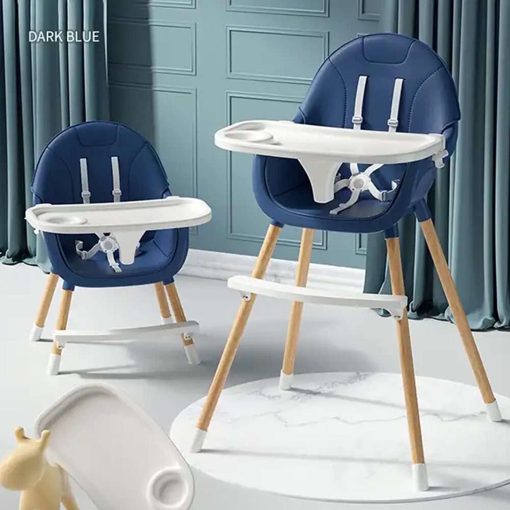 Chaise haute repas bébé évolutive en bleu foncé, avec harnais de sécurité et plateau amovible, idéale pour les repas des enfants.